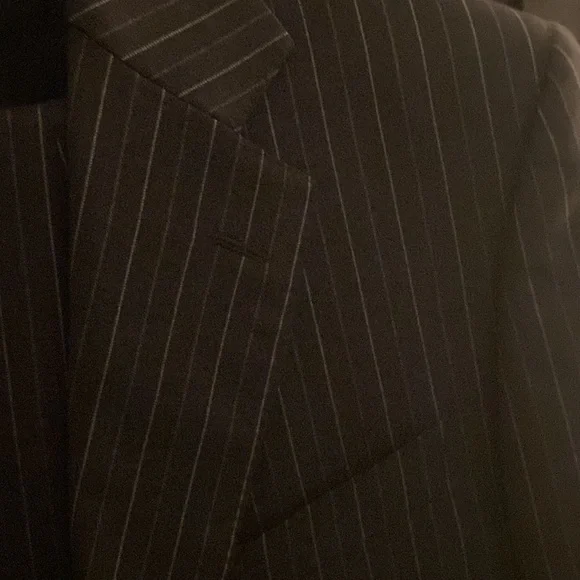 Charcoal double striped suit. Two button, single breast, notch lapel.